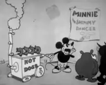 As audiences watch an off-screen dance, Mickey Mouse operates a hot dog stand, calling out to others.