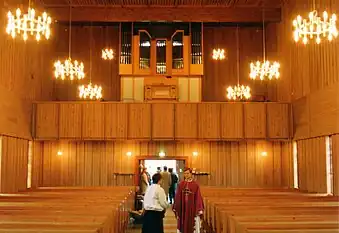 Inside Båtsfjord Church, facing the church organ and the public entrance/exit.