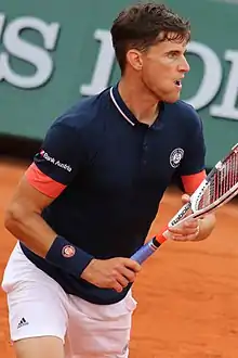 Tennis player Dominic Thiem prepares to hit a shot.