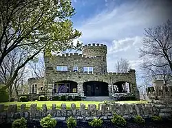 Front photo of a stone residential building