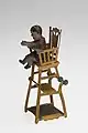 Baby in highchair, tin toy with moveable parts, German manufacture, before 1914