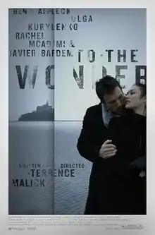 A man embraces a woman from behind while they are in front of a sea. A vertical line mimicking the hinge of a book is placed off-center to the left, with an island in the sea seemingly disappearing into the hinge. The faded title and credits surround the hinge, while a white border surrounds the whole picture, with further credits located at its bottom.