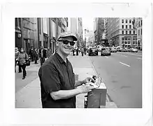 Christopher sketching on the streets of New York