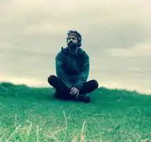 Tom Cox on a cliff-top in East Devon