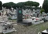 The headstone features a bronze bas-relief portrait of Hirschfeld in profile