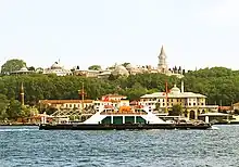 The palace atop a hill with the Bosporus in the foreground