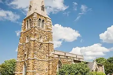 The bell tower, note the niches on the west side for statues of saints.