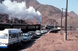 A steam locomotive and a diesel locomotive near Badaling in 1979