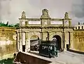 Tram car 12 heading for Valletta and about to pass through 'Porte des Bombes' in Floriana, circa 1910