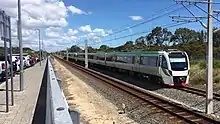 Electric passenger train on railway tracks