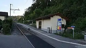 Single-tracked railway line with platform and shelter