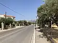 The main road in Tsoukaleika with Panachaiko in the background.