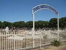 Cemetery and gates with town name