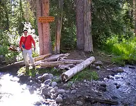 Here Two Ocean Creek splits in two directions on the Continental Divide. Water on the left in this 2011 photo goes to the Atlantic and water on the right to the Pacific Ocean.