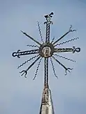 Lithuanian type of cross - saulutė (little sun) containing ancient, pre-Christian motifs.