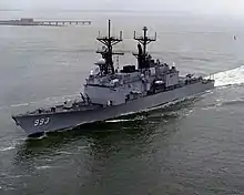 Aerial view of USS Kidd entering a harbour