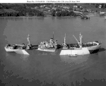 USS Phobos (AK-129) at anchor in the Mississippi River near New Orleans, LA., circa 20 June 1944. A troop carrier, this ship was the only one of this class converted by the War Shipping Administration instead of the Navy. Note the platform on the bow for two 40 mm guns side by side, and the numerous minor differences in configuration compared to her sisters.