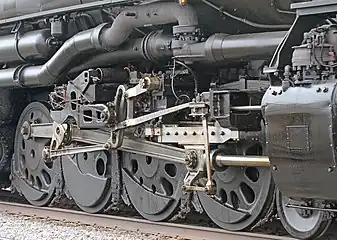 A close-up of one of the articulated steam locomotive's set of wheels