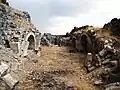 Ruins of an arched structure at the base of the monastic complex