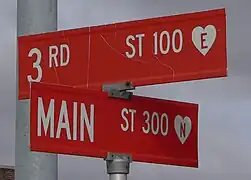 Street signs in a small town, with house numbers