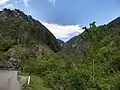 Mount Tavagnone, Sas Valley taken from the locality of Fucina to the Nangone Bridge on Provincial Road No. 9, in the background of the Valley the Fobbiola Pass that connects the trail from the locality of Apene of Mount Camiolo with the mountain