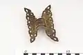 Her gilded bronze butterfly clasp