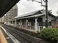 Rear of station building, with level crossing leading to Platform 1.