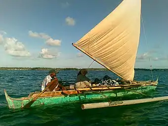 A modern undecorated tondaan without the prow and stern extensions and with a plain sail from the Bajau of Sabah