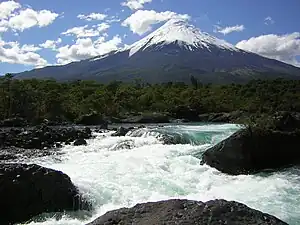 Osorno in front of the Petrohué Waterfalls.