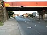 Wakefield Road, Bradford, looking south up the A650 road. This bridge used to carry the Bowling to Laisterdyke line.