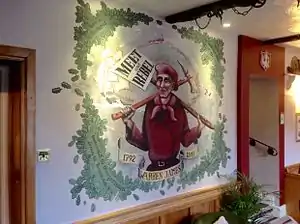 Stylised mural of the miners' leader Warren James, at a public house in Parkend, Gloucestershire