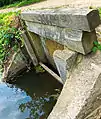 A small waste weir without paddle valves to drain the prism.