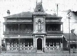 Waterloo Town Hall c. 1916, showing the original ironwork verandahs and fencing