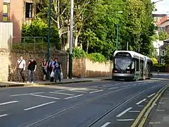 A southbound tram descends the steep gradient