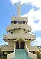 Kristus Raja Christ statue at Weluan, reflecting the region's strong Christian faith.