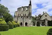 Library (left) and arched entrance to the chapter house, from the cloister