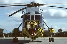 A Westland Sea King HAS6 of 814 NAS in a tiger colour-scheme, representing the unit's status as a member of the NATO Tiger Association.