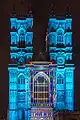 Coloured light projected onto Westminster Abbey for Lumiere festival