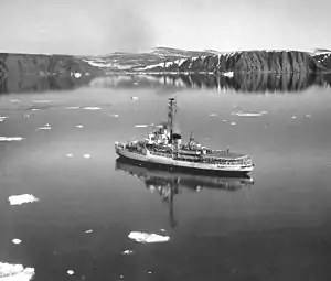 USCGC Westwind near Cape Atholl, Greenland, returning from artic cruise (1964).