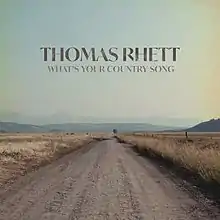 Photo of a dirt road surrounded by fields and the words "Thomas Rhett" and "What's Your Country Song" written in all caps.