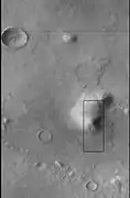 CTX image of the next image showing a wide view of the area.  Since the hill is isolated it would be difficult for an aquifer to develop.  Rectangle shows the approximate location of the next image.