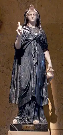 Statue of a woman in an elaborate robe with a small headdress