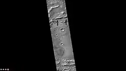 Cruls Crater, as seen by CTX camera (on Mars Reconnaissance Orbiter).  Arrows indicate old glaciers.