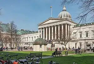 The UCL main building, in stone with a classical portico topped by a large dome