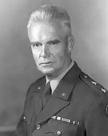 A Caucasian man with gray hair in a military uniform.