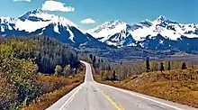 Sunshine Mountain (left) and Wilson Peak (right) from southbound Highway 145