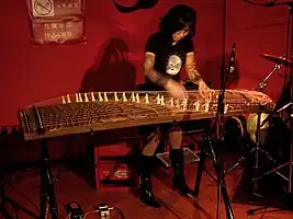 Michiyo Yagi playing a 21-string koto