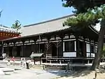 Wooden building with white walls and a slightly raised floor.