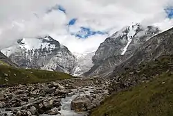 Two mountains shrouded in clouds