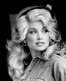 Denim jackets and headbands were also a trend, modeled here by Dolly Parton in 1977